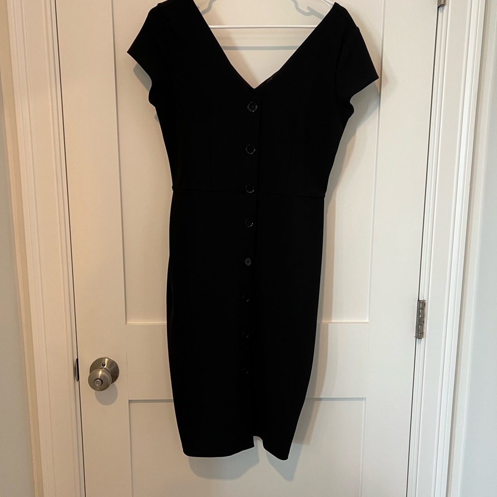 A closet staple! Black V-Neck Mini Dress